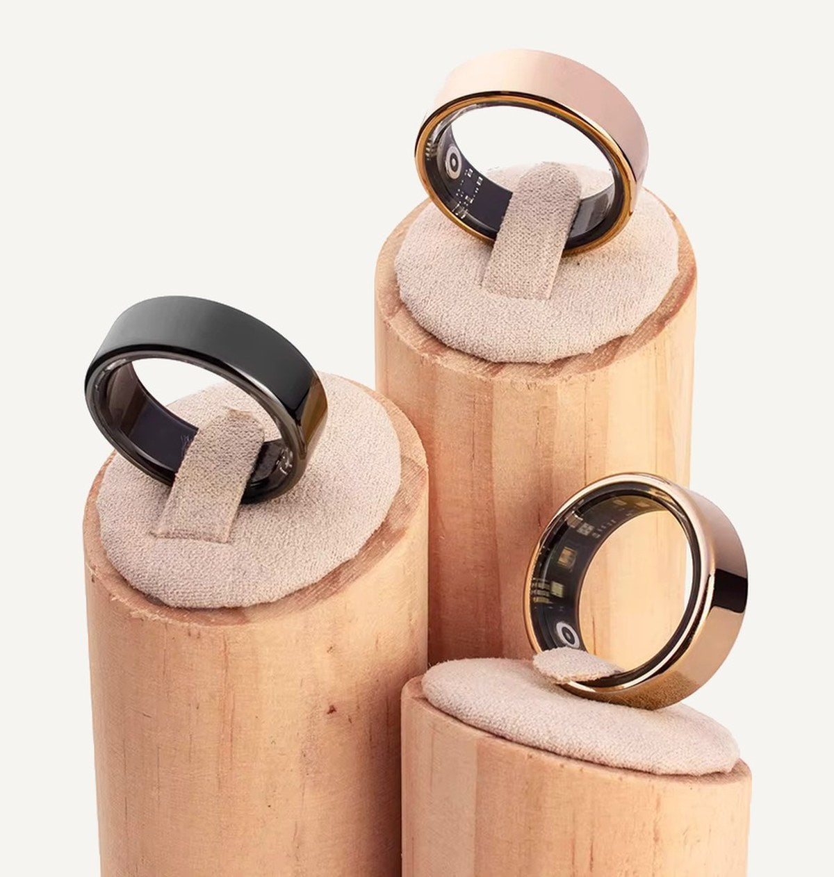 Three Aurora rings in black, rose gold and copper finishes